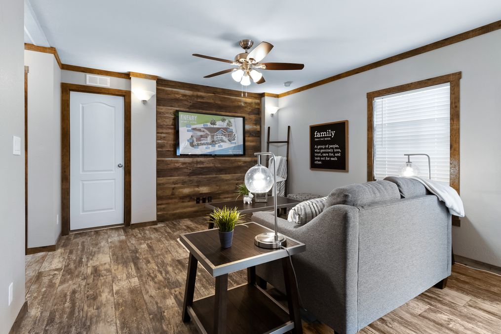 The THE MAVERICK Family Room. This Manufactured Mobile Home features 4 bedrooms and 2 baths.