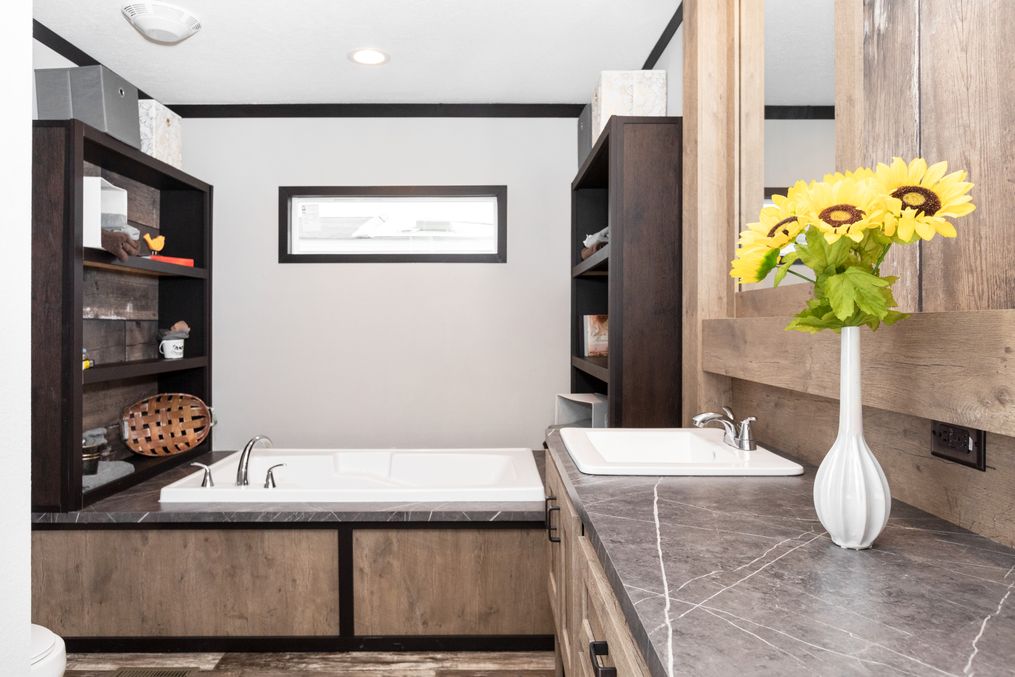 The BOUJEE Primary Bathroom. This Manufactured Mobile Home features 3 bedrooms and 2 baths.
