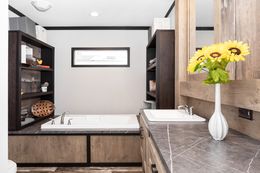 The BOUJEE Primary Bathroom. This Manufactured Mobile Home features 3 bedrooms and 2 baths.