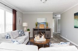 The 5621 "THE RICHMOND" 7628 Family Room. This Manufactured Mobile Home features 4 bedrooms and 2 baths.