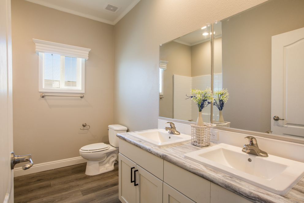 The EDGEWOOD Primary Bathroom. This Manufactured Mobile Home features 3 bedrooms and 2 baths.