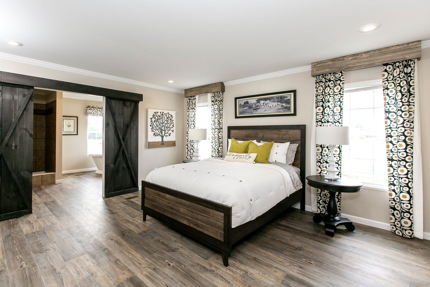 The FREEDOM FARM HOUSE  32X60 Primary Bedroom. This Manufactured Mobile Home features 3 bedrooms and 2 baths.