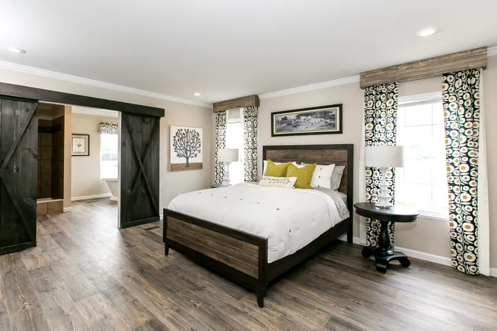 The FREEDOM FARM HOUSE  32X60 Primary Bedroom. This Manufactured Mobile Home features 3 bedrooms and 2 baths.
