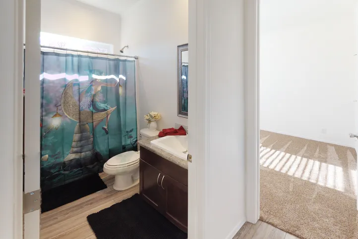 The SUM3068A Guest Bathroom. This Manufactured Mobile Home features 3 bedrooms and 2 baths.
