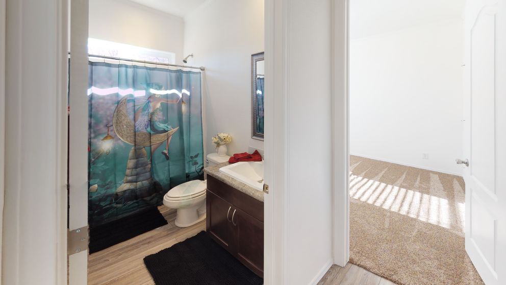 The SUM3068A Guest Bathroom. This Manufactured Mobile Home features 3 bedrooms and 2 baths.