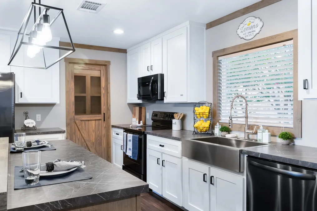 The FARMHOUSE 3 Kitchen. This Manufactured Mobile Home features 3 bedrooms and 2 baths.
