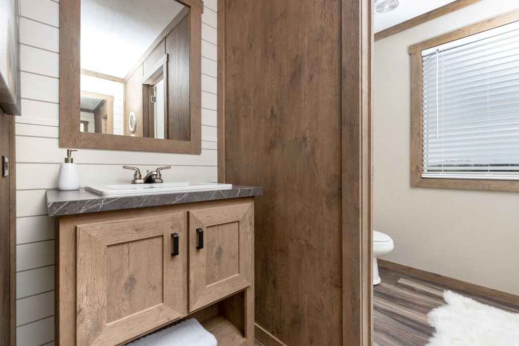 The EMMELINE Guest Bathroom. This Manufactured Mobile Home features 4 bedrooms and 2 baths.