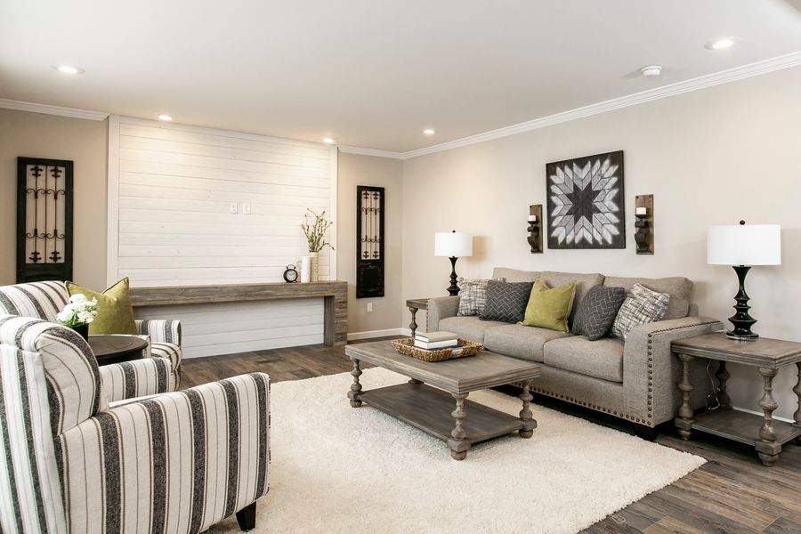 The FREEDOM FARM HOUSE  32X60 Living Room. This Manufactured Mobile Home features 3 bedrooms and 2 baths.