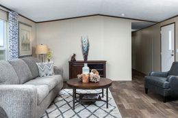 The VICTORY PLUS Living Room. This Manufactured Mobile Home features 3 bedrooms and 2 baths.