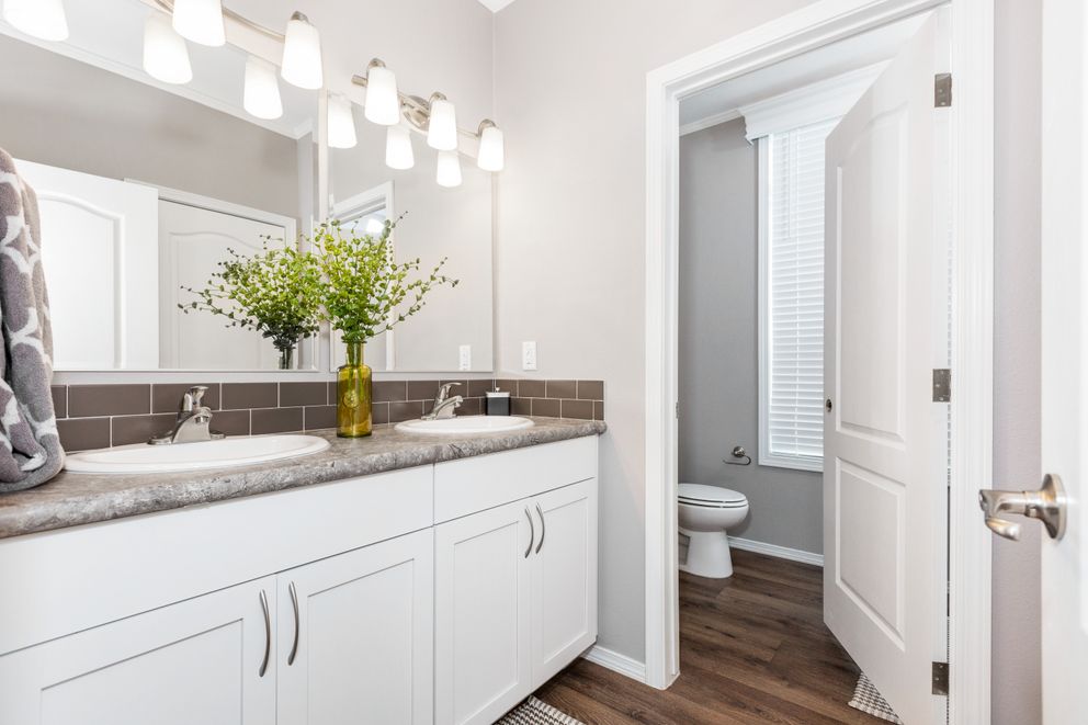 The ENCHANTMENT 3070A Primary Bathroom. This Manufactured Mobile Home features 3 bedrooms and 2 baths.