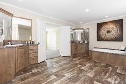 The 5808 ENTERPRISE 7632 Primary Bathroom. This Manufactured Mobile Home features 4 bedrooms and 2 baths.