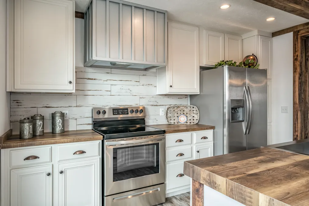 The THE AVALYN Kitchen. This Manufactured Mobile Home features 3 bedrooms and 2 baths.