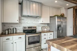 The THE AVALYN Kitchen. This Manufactured Mobile Home features 3 bedrooms and 2 baths.