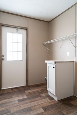 The FARMHOUSE BREEZE 72 Utility Room. This Manufactured Mobile Home features 4 bedrooms and 2 baths.