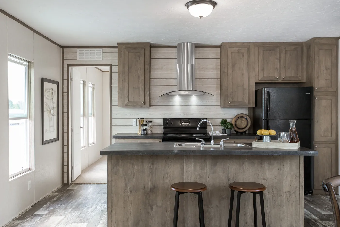 The THE BREEZE Kitchen. This Manufactured Mobile Home features 3 bedrooms and 2 baths.