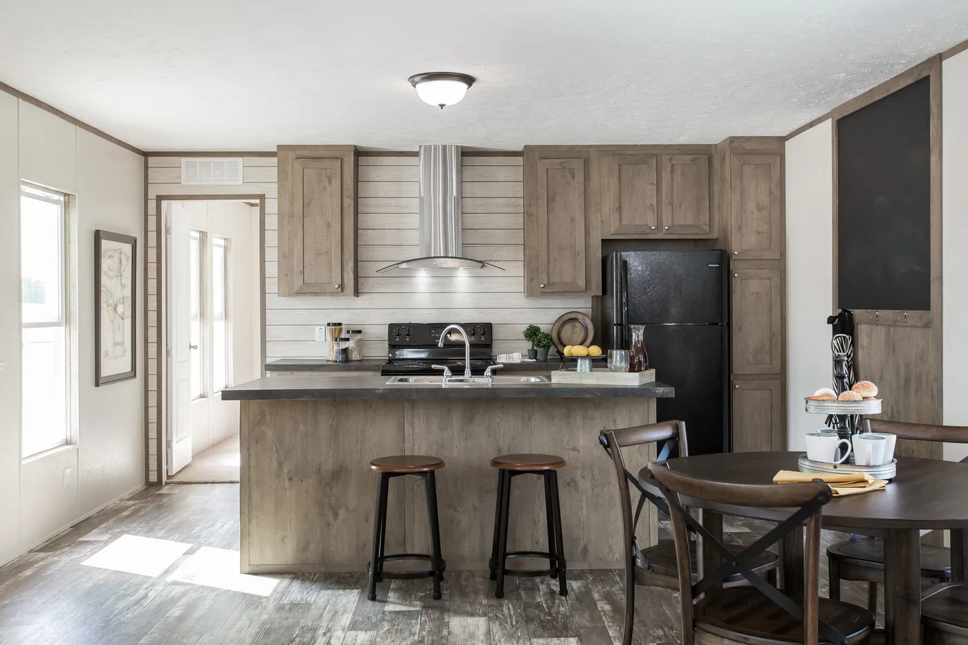 The THE BREEZE Kitchen. This Manufactured Mobile Home features 3 bedrooms and 2 baths.