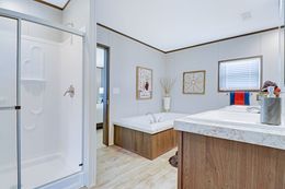 The THE ANNIVERSARY 2.1 Primary Bathroom. This Manufactured Mobile Home features 3 bedrooms and 2 baths.
