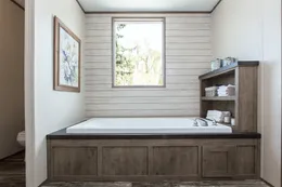 The THE BREEZE II Primary Bathroom. This Manufactured Mobile Home features 4 bedrooms and 2 baths.