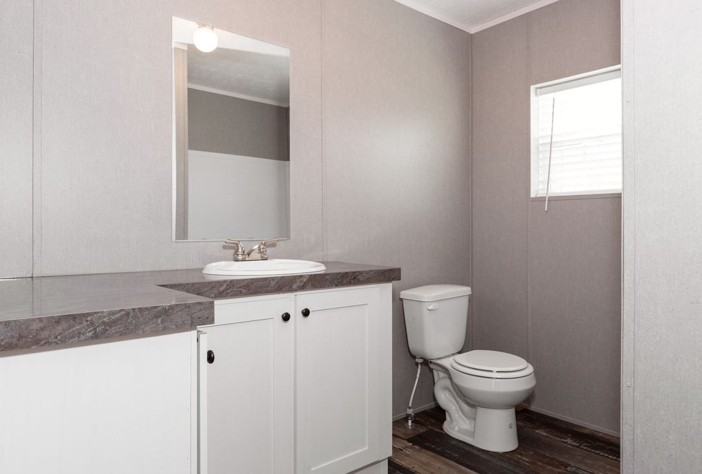 The TRADITION 76C Guest Bathroom. This Manufactured Mobile Home features 4 bedrooms and 2 baths.