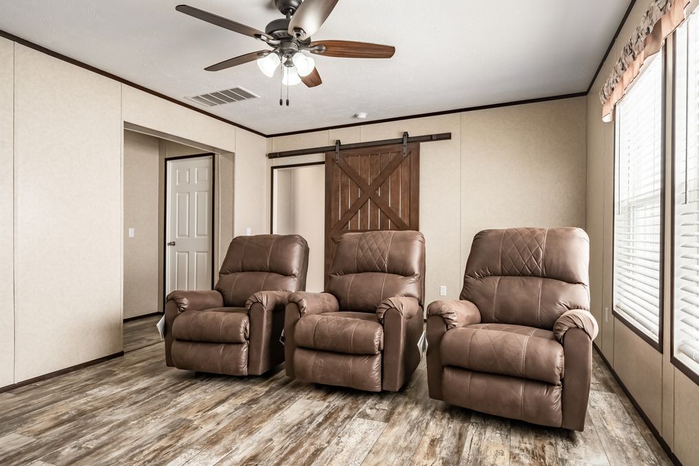 The THE TYRA Family Room. This Manufactured Mobile Home features 4 bedrooms and 2 baths.