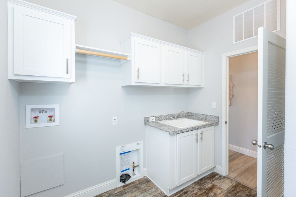 The GE662K Utility Room. This Manufactured Mobile Home features 4 bedrooms and 2 baths.