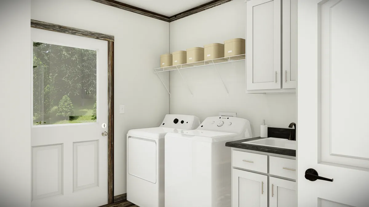 The THE SUMNER Utility Room. This Manufactured Mobile Home features 3 bedrooms and 2 baths.