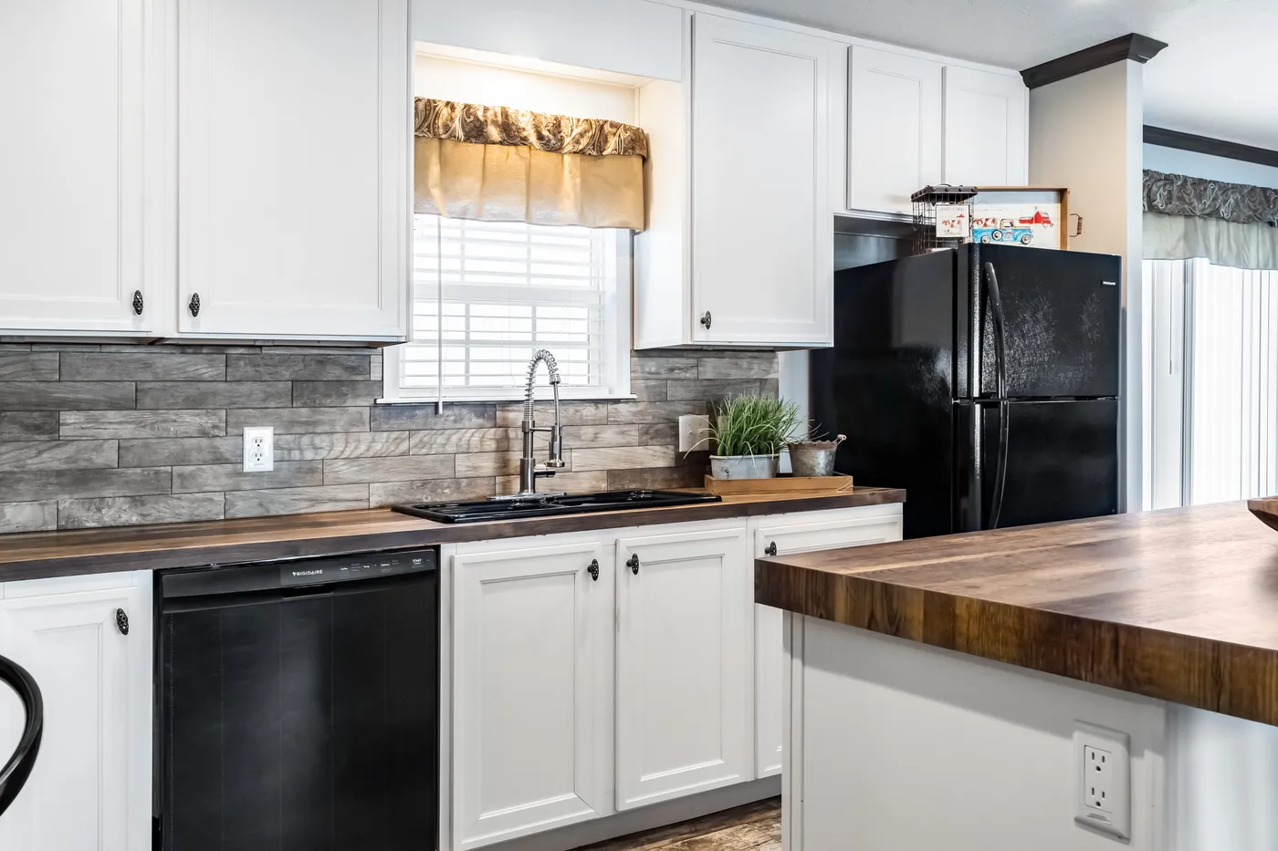 The THE STARK Kitchen. This Manufactured Mobile Home features 3 bedrooms and 2 baths.