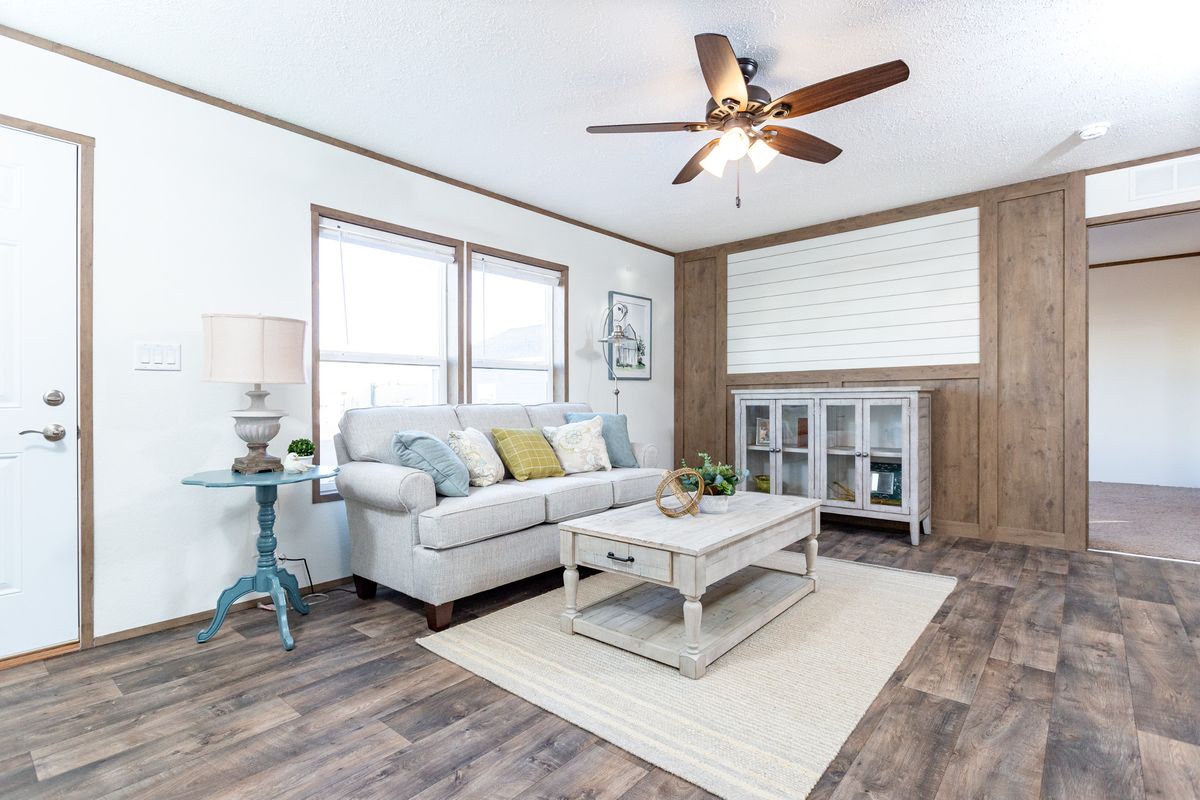 The LIFESTYLE 211 Living Room. This Manufactured Mobile Home features 3 bedrooms and 2 baths.