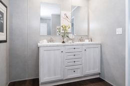 The ULTRA BREEZE 76 Primary Bathroom. This Manufactured Mobile Home features 4 bedrooms and 2 baths.
