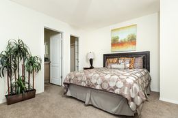 The FAIRPOINT 14602A Primary Bedroom. This Manufactured Mobile Home features 2 bedrooms and 2 baths.