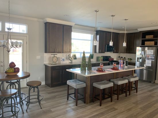 Huge gourmet kitchen with huge island and upgraded gourmet appliances plus tall cabinets and pantry