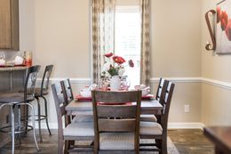 The 3328 CLASSIC Dining Area. This Manufactured Mobile Home features 4 bedrooms and 2 baths.
