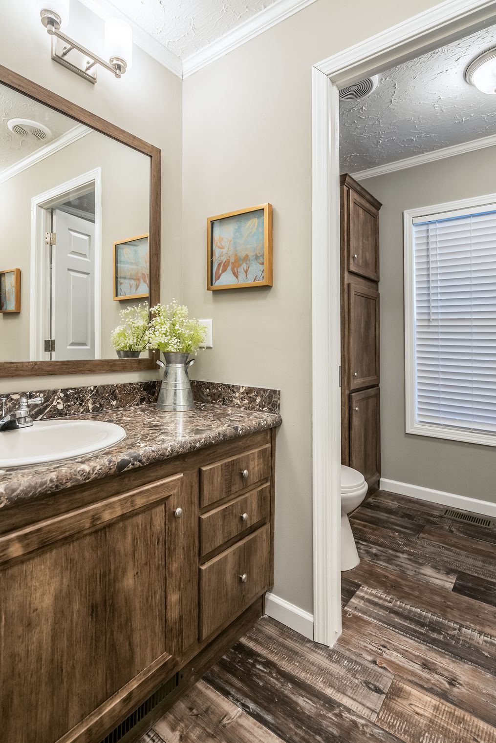 The 5607 ENTERPRISE 7228 Guest Bathroom. This Manufactured Mobile Home features 4 bedrooms and 2 baths.