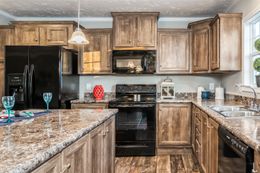 The 5607 ENTERPRISE 7228 Kitchen. This Manufactured Mobile Home features 4 bedrooms and 2 baths.