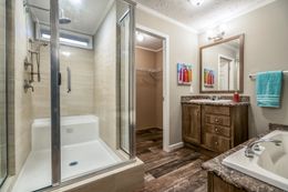 The 5607 ENTERPRISE 7228 Master Bathroom. This Manufactured Mobile Home features 4 bedrooms and 2 baths.