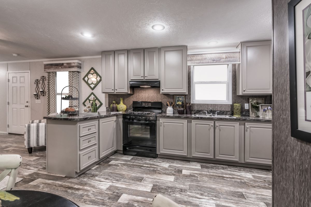 The 6616-711 THE PULSE Kitchen. This Manufactured Mobile Home features 3 bedrooms and 2 baths.