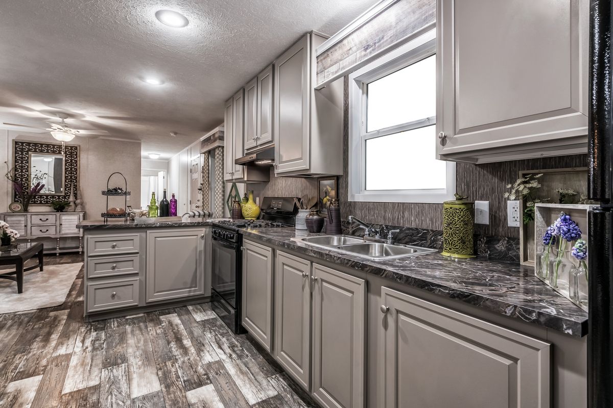 The 6616-711 THE PULSE Kitchen. This Manufactured Mobile Home features 3 bedrooms and 2 baths.