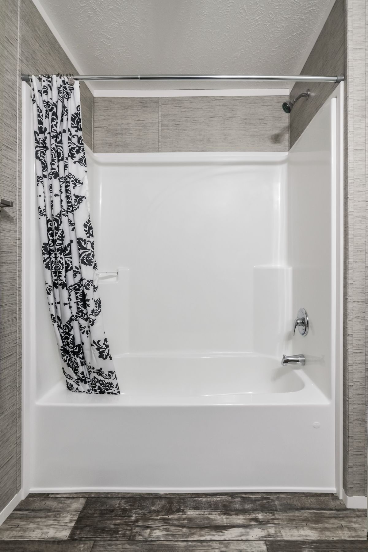 The 6616-711 THE PULSE Primary Bathroom. This Manufactured Mobile Home features 3 bedrooms and 2 baths.