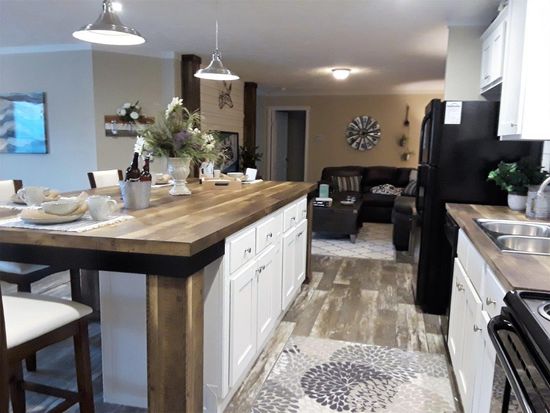 The ANSWER M375 Kitchen. This Manufactured Mobile Home features 4 bedrooms and 2 baths.