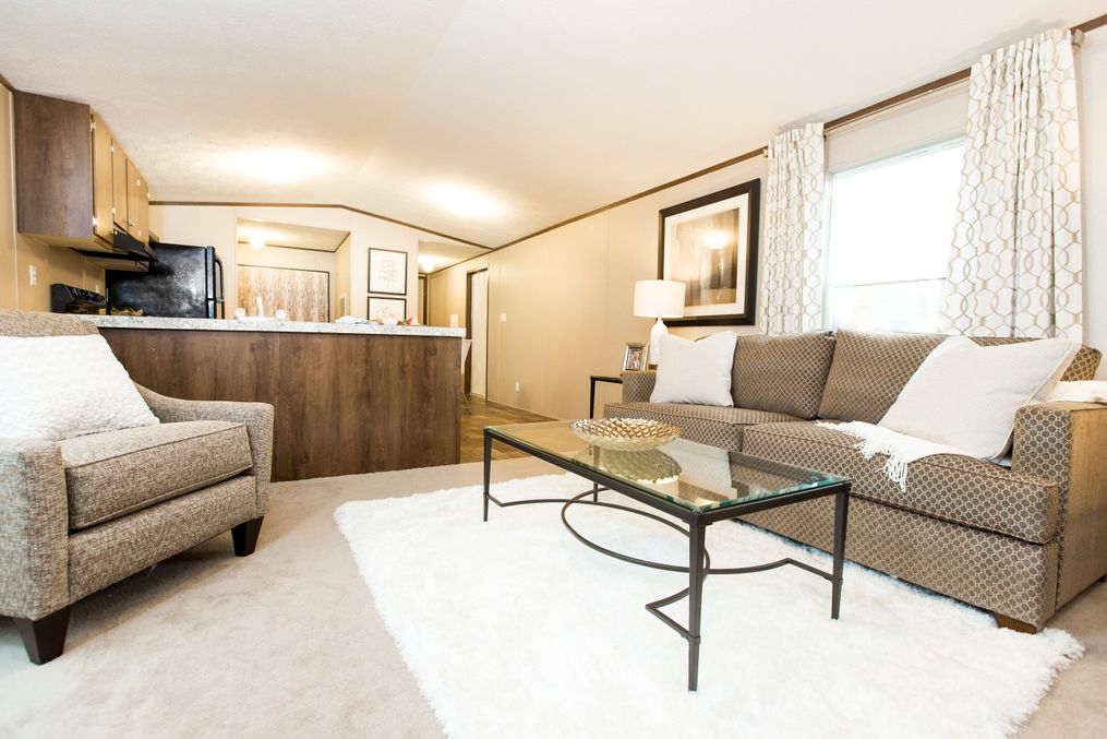 The BLISS Living Room. This Manufactured Mobile Home features 2 bedrooms and 1 bath.