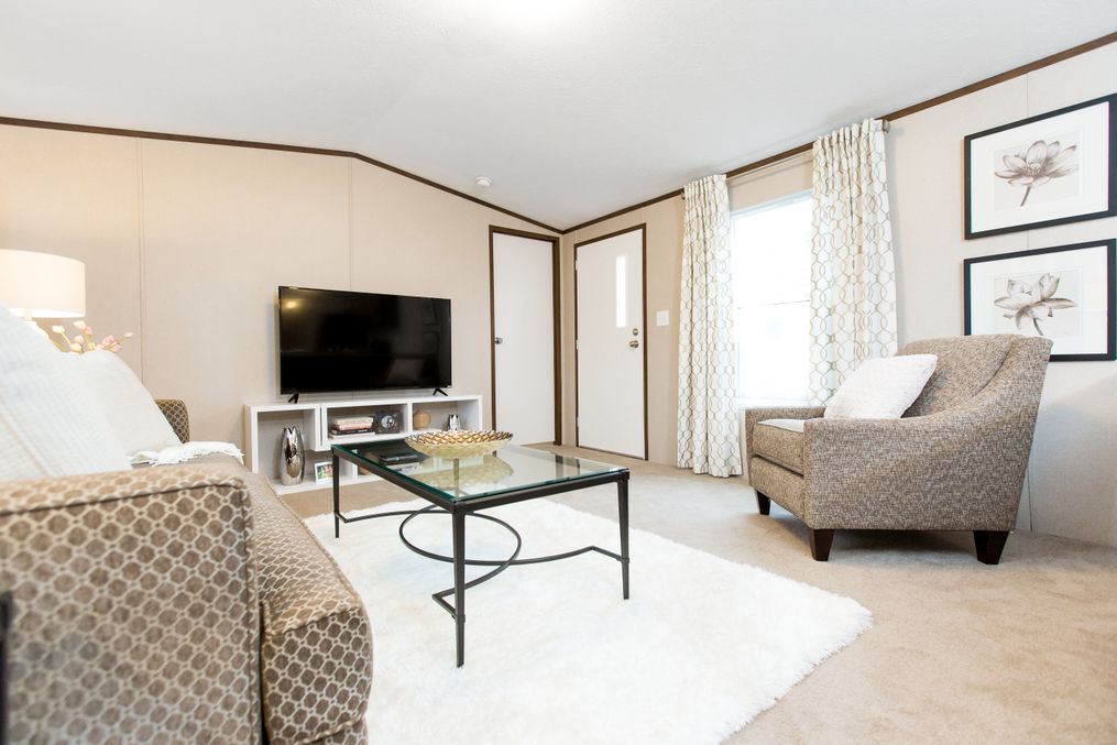 The BLISS Living Room. This Manufactured Mobile Home features 2 bedrooms and 1 bath.