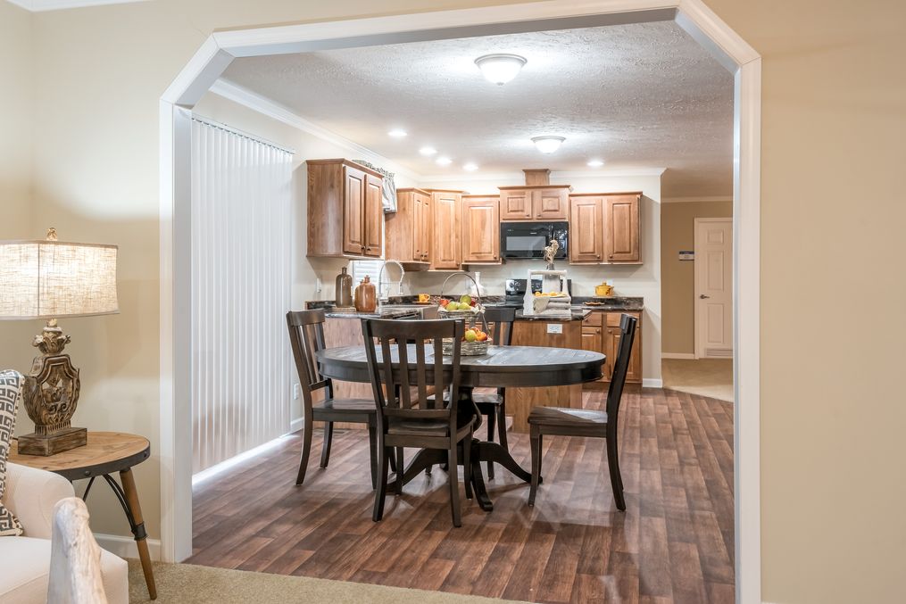 The BROOKLINE FLEX Dining Area. This Manufactured Mobile Home features 4 bedrooms and 2 baths.