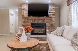 The BROOKLINE FLEX Living Room. This Manufactured Mobile Home features 4 bedrooms and 2 baths.