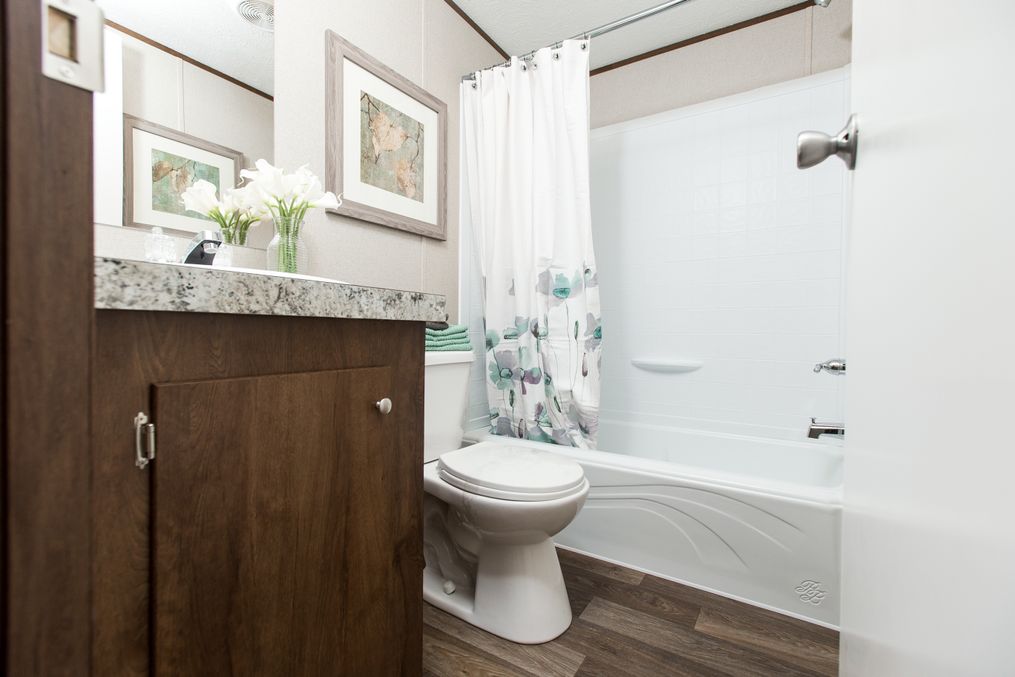 The DELIGHT Primary Bathroom. This Manufactured Mobile Home features 2 bedrooms and 2 baths.