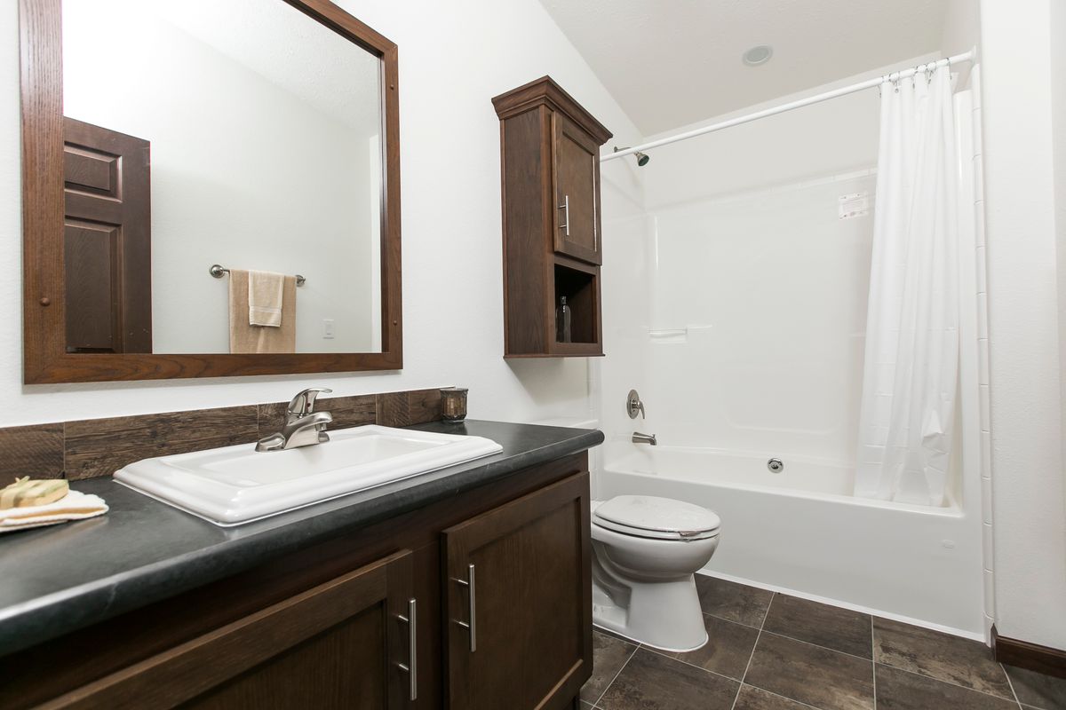 The FREEDOM 377 Guest Bathroom. This Manufactured Mobile Home features 3 bedrooms and 2 baths.