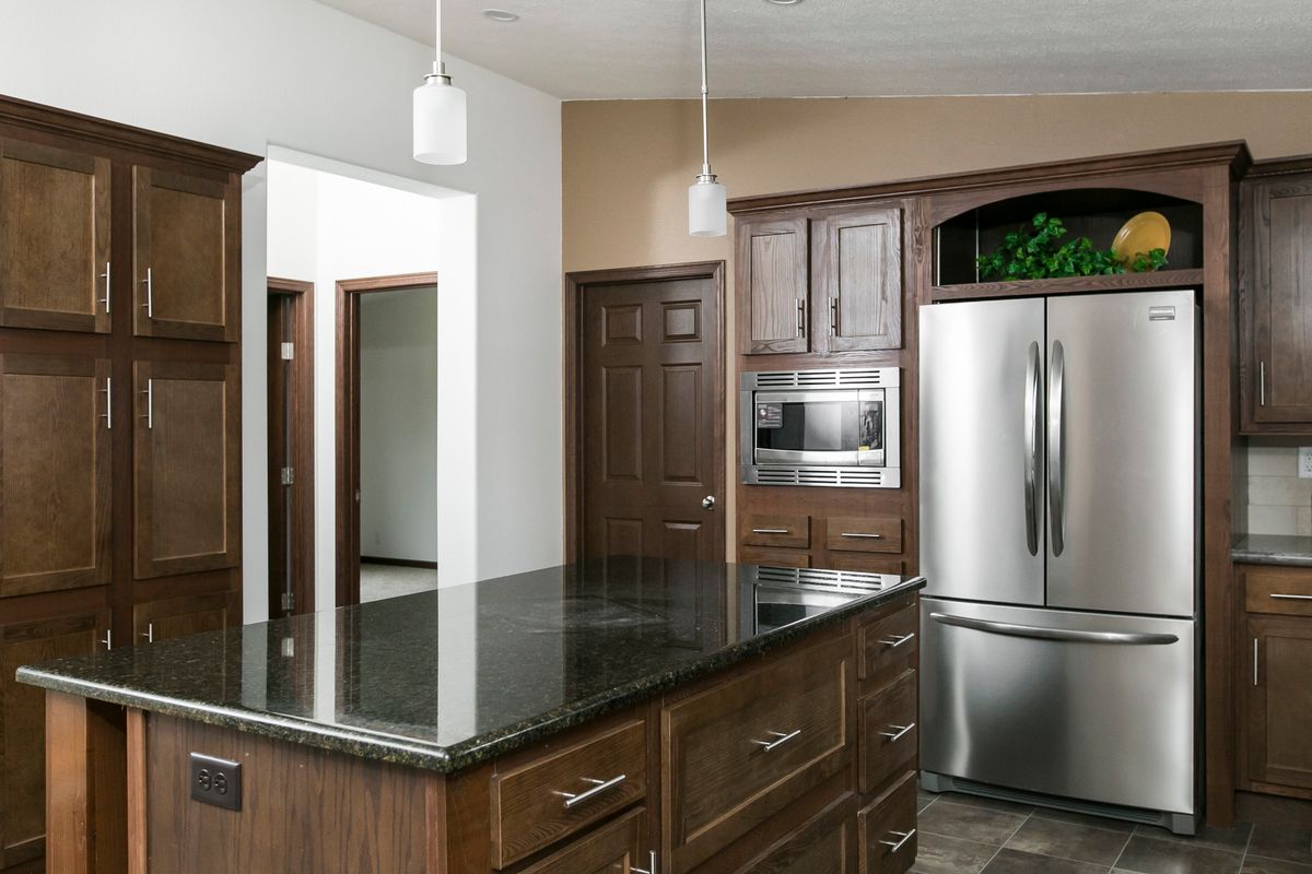 The FREEDOM 377 Kitchen. This Manufactured Mobile Home features 3 bedrooms and 2 baths.