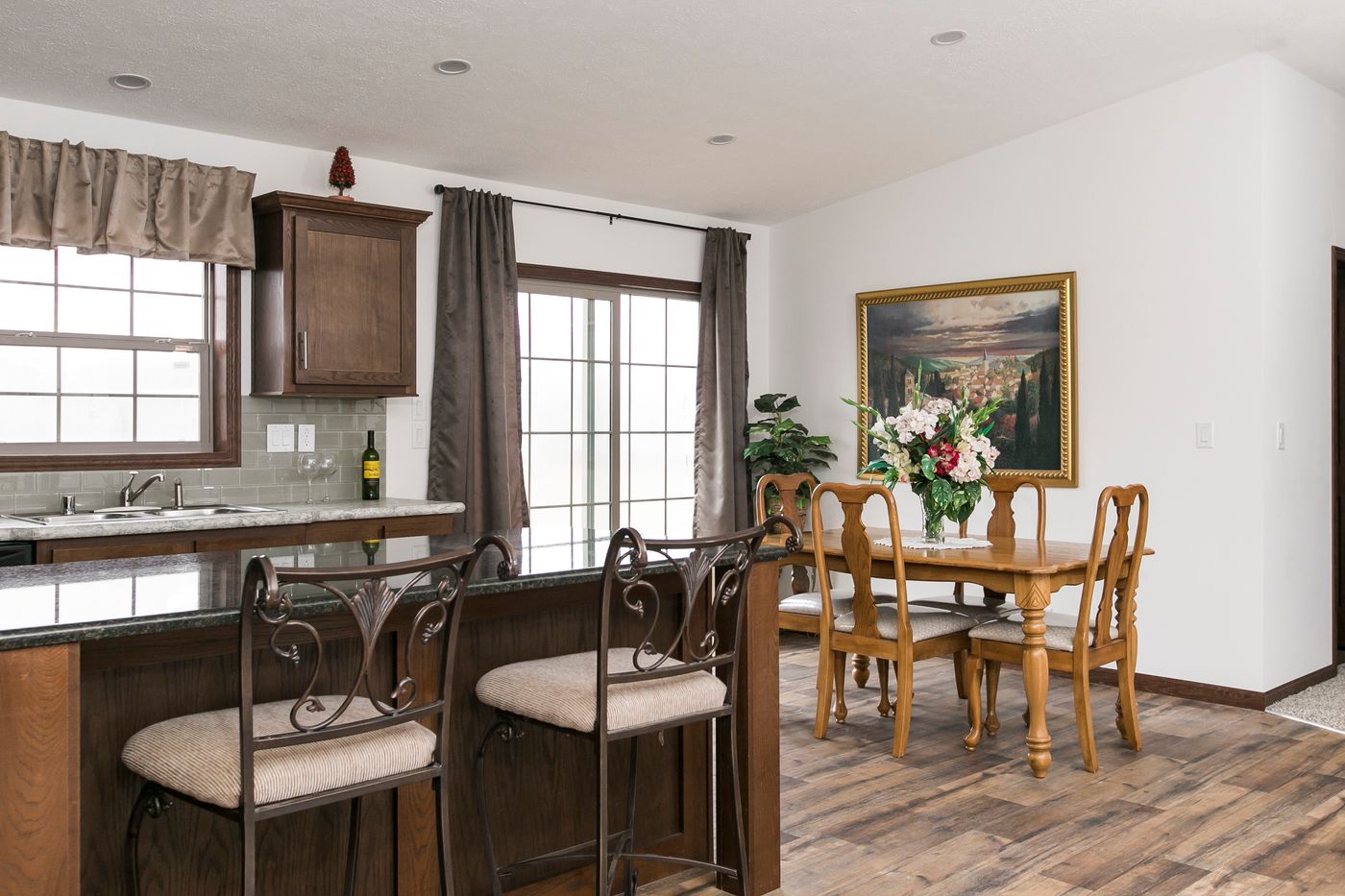 The FREEDOM 405 Dining Area. This Manufactured Mobile Home features 3 bedrooms and 2 baths.