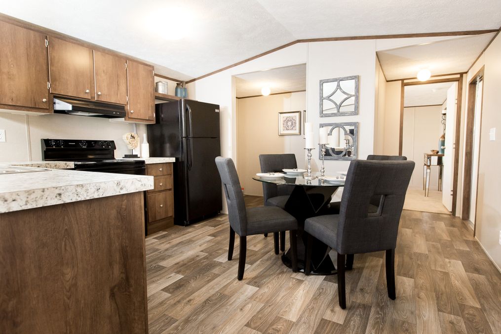 The GLORY Dining Area. This Manufactured Mobile Home features 3 bedrooms and 2 baths.