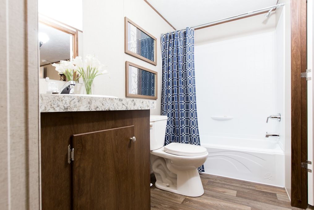 The GLORY Guest Bathroom. This Manufactured Mobile Home features 3 bedrooms and 2 baths.