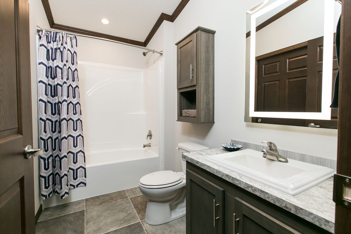 The INDEPENDENCE 29 Guest Bathroom. This Manufactured Mobile Home features 4 bedrooms and 2 baths.